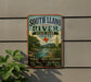 A vintage-style sign for South Llano River State Park in Texas, featuring a scenic landscape with a river, mountains, and a desert backdrop.