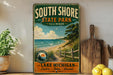 A vintage-style metal sign for South Shore State Park in Illinois, featuring a scenic beach landscape with a lake and a wooden fence.
