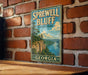 A vintage-style metal sign for Sprewell Bluff State Park in Georgia, featuring a scenic landscape with a river and mountains.