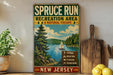 A vintage-style sign for the SPRUCE RUN Recreation Area in New Jersey, featuring a scenic illustration of a lake, pine trees, and a sailboat.