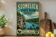 A vintage-style poster advertising Stonelick State Park, Ohio, featuring a scenic landscape with a lake, mountains, and a boat.