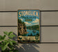 A vintage-style sign for Stonelick State Park, Ohio, featuring a scenic landscape with a lake, cliffs, and a boat.