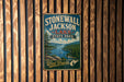 A vintage-style metal sign for Stonewall Jackson Lake State Park in West Virginia, featuring a scenic landscape with a lake and mountains.