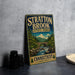 A vintage-style metal sign for Stratton Brook State Park in Connecticut, featuring a scenic landscape with a bridge and waterfall.