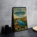 a vintage-style sign for Sully Creek State Park in North Dakota, with a scenic illustration of a river and mountains.