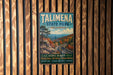 A vintage metal sign for Talimena State Park in Oklahoma, featuring a scenic landscape with a winding road and autumn foliage.