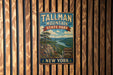 A vintage metal sign for Tallman Mountain State Park in New York, featuring a scenic mountain landscape and text indicating the park's location and attractions.
