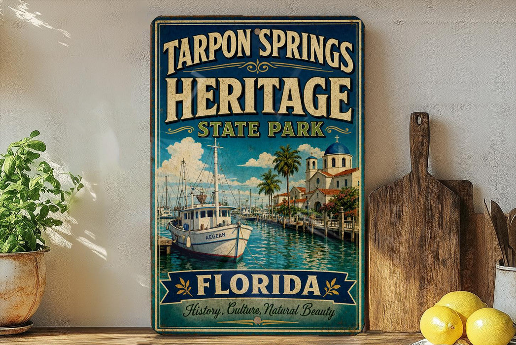 A vintage-style sign for Tarpon Springs Heritage State Park in Florida, featuring a boat and palm trees, is displayed on a shelf next to a wooden cutting board and some lemons.