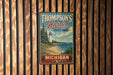 A vintage-style metal sign for Thompson's Harbor State Park in Michigan, featuring a lighthouse and a scenic landscape.