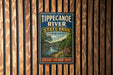 A vintage metal sign for Tippecanoe River State Park in Indiana, featuring a scenic illustration of the river and surrounding landscape.