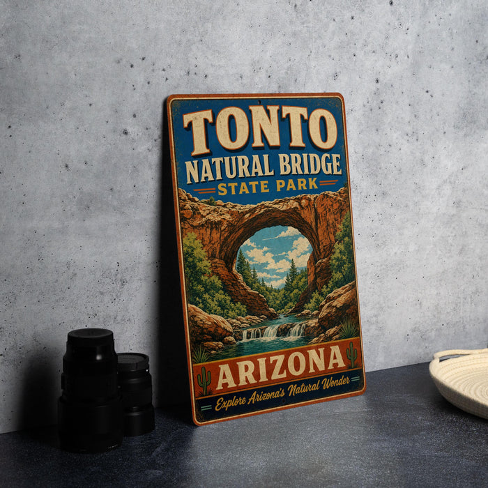 A vintage-style sign for Tonto Natural Bridge State Park in Arizona, featuring an illustration of the bridge and the surrounding landscape.
