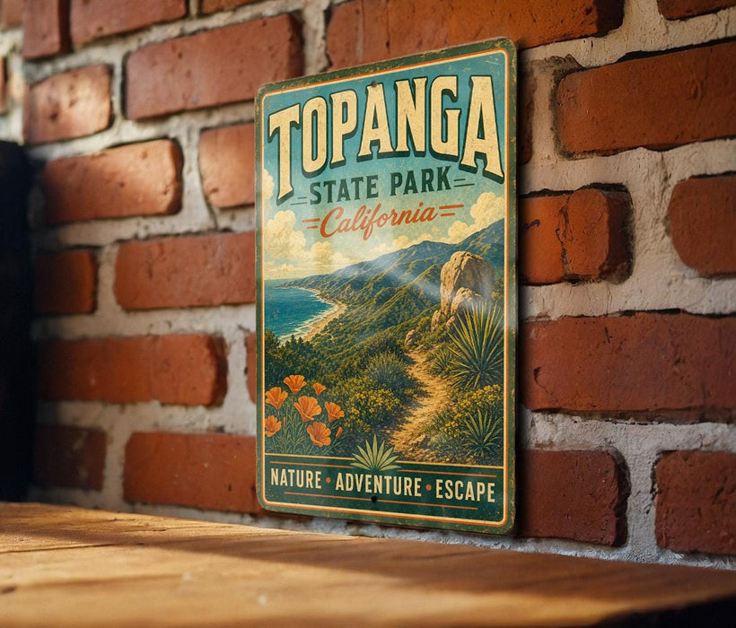 A vintage-style metal sign for Topanga State Park in California, featuring a scenic landscape with mountains, palm trees, and a beach.