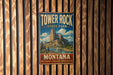 A vintage metal sign for Tower Rock State Park in Montana, featuring a scenic illustration of the park's landscape.