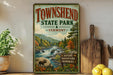 A vintage-style sign for Townshend State Park in Vermont, featuring a scenic landscape with a river, mountains, and wildlife.