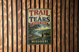 A vintage metal sign for Trail of Tears State Park in Missouri, featuring a scenic illustration of a river and mountains.