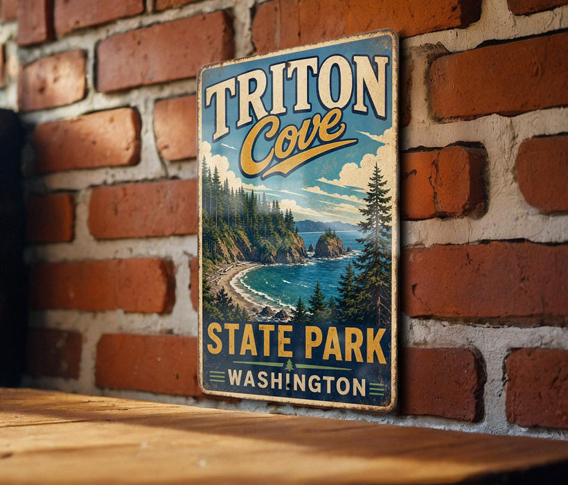 A vintage metal sign for Triton Cove State Park in Washington, featuring a scenic landscape with a beach, mountains, and pine trees.