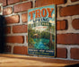 A vintage-style metal sign for Troy Spring State Park in Florida, featuring a scenic image of the park's natural beauty, history, and recreation.