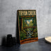 A vintage-style metal sign for the "Tryon Creek State Natural Area" in Oregon, featuring a scenic illustration of a forest and a bridge.