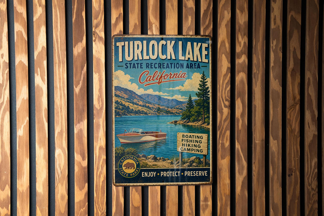 A vintage metal sign for Turlock Lake, California, featuring a scenic image of a lake surrounded by mountains and a boat.