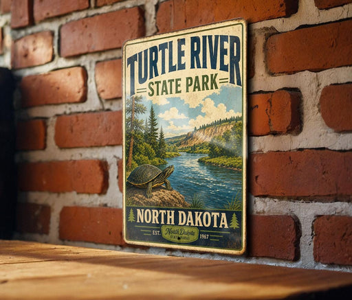 A vintage-style metal sign for Turtle River State Park in North Dakota, featuring a scenic illustration of a river and forest landscape.