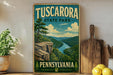 A vintage-style poster of Tuscarora State Park in Pennsylvania, featuring a scenic landscape with a river, mountains, and a cliff overlooking the water.