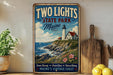 A vintage-style sign for "Two Lights State Park Maine" is displayed on a shelf, featuring a lighthouse and a coastal landscape.