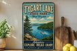 A vintage-style sign for Tygart Lake State Park in West Virginia, featuring a scenic image of the lake surrounded by mountains and trees.