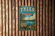 A vintage-style metal sign for Tyler State Park in Pennsylvania, featuring a scenic landscape with a lake, mountains, and trees.