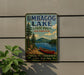 A vintage-style metal sign for Umbagog Lake State Park in New Hampshire, featuring a canoe and a scenic landscape.