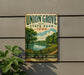 A vintage-style metal sign for Union Grove State Park in Iowa, featuring a scenic landscape with a lake, trees, and a path.