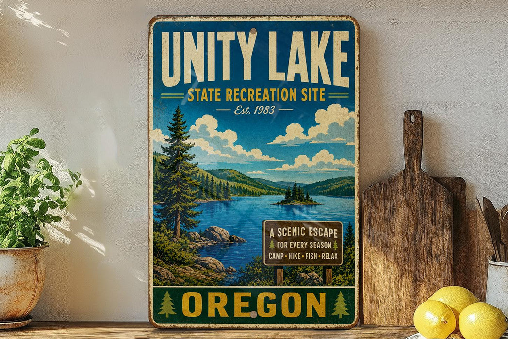 A vintage-style sign for the Unity Lake State Recreation Site in Oregon, featuring a scenic landscape with a lake, mountains, and pine trees.