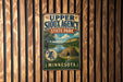 A vintage metal sign for Upper Sioux Agency State Park in Minnesota, featuring a scenic illustration of the park and its surroundings.