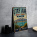A vintage-style sign for Utah Lake State Park, featuring a scenic illustration of the lake and mountains.