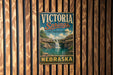 A vintage metal sign for Victoria Springs, a state recreation area in Nebraska, is displayed on a wooden wall.