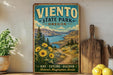 A vintage-style poster for Viento State Park, Oregon, featuring a scenic landscape with mountains, a river, and sunflowers.