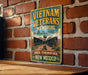 a sign for Vietnam Veterans Memorial in New Mexico, mounted on a brick wall.