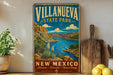 A vintage-style sign for Villanueva State Park in New Mexico, featuring a scenic landscape with mountains, a lake, and desert vegetation.