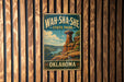 A vintage-style metal sign for Wah-Sha-She State Park in Oklahoma, featuring a scenic landscape with a rock formation and a river.