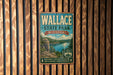 A vintage-style metal sign for Wallace State Park in Missouri, featuring a scenic landscape with a lake and mountains.