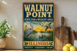 A vintage-style sign for Walnut Point State Fish & Wildlife Area in Illinois, featuring illustrations of birds and a sunset over a lake.