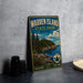 A vintage metal sign for Warren Island State Park in Maine, featuring a scenic illustration of the island's landscape with pine trees, rocky cliffs, and a body of water.