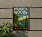 A vintage metal sign for Warren Woods State Park in Michigan, featuring a scenic illustration of a forest and a lake.