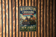 A vintage-style metal sign for Washington Crossing State Park in New Jersey, featuring an illustration of a group of people in a boat with an American flag.