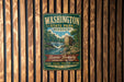 A vintage metal sign for Washington State Park in Missouri, featuring a scenic illustration of a waterfall and a building.