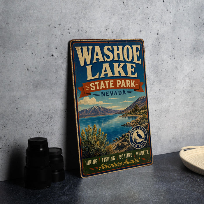 A vintage-style metal sign for Washoe Lake State Park, Nevada, featuring a scenic landscape with mountains, a lake, and text promoting the park's attractions.