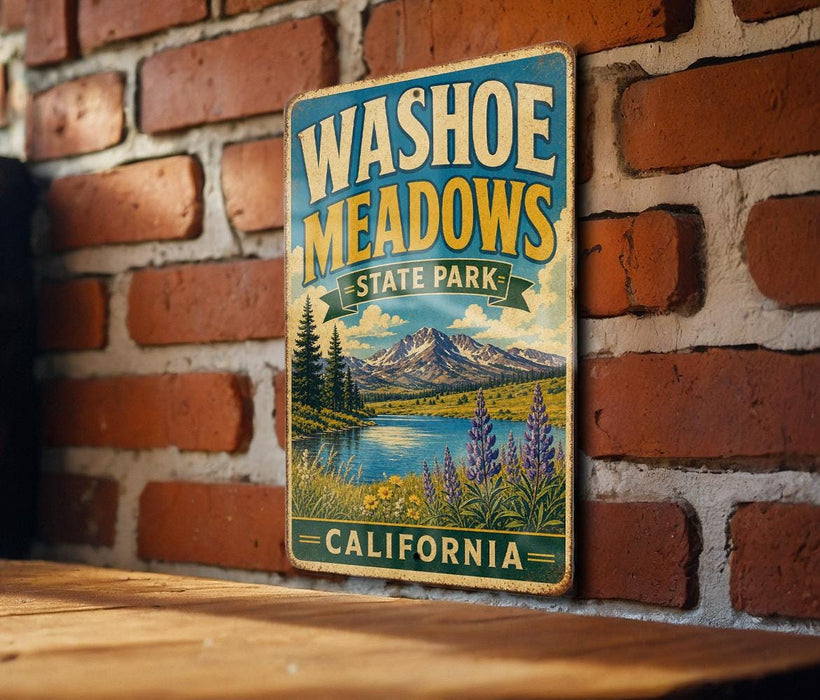 A vintage-style metal sign for Washoe Meadows State Park in California, featuring a scenic landscape with mountains, a lake, and wildflowers.