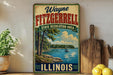 A vintage-style sign for Wayne Fitzgerald State Recreation Area in Illinois, featuring a scenic landscape with a lake and trees.