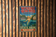 A vintage-style metal sign for Weeki Wachee Springs, Florida, featuring a mermaid and a boat on a lake.