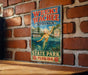 A vintage-style sign for Weeki Wachee Springs, Florida, featuring a mermaid illustration and text.