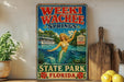 A vintage-style poster advertising Weeki Wachee Springs, featuring a mermaid and a boat on a lake, with the text "Weeki Wachee Springs State Park, Florida" and "Welcome to the Real mermaid".